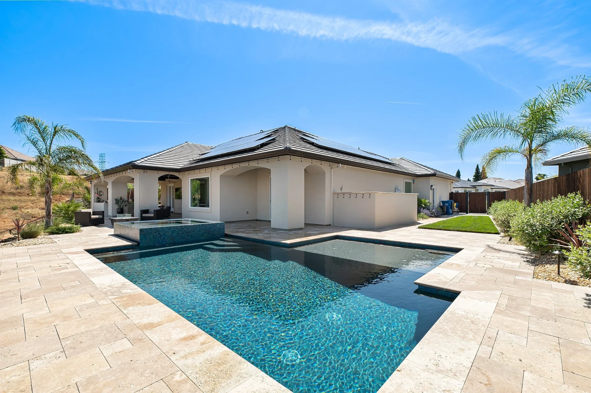 Clean backyard swimming pool serviced by Nabors Pools in Houston